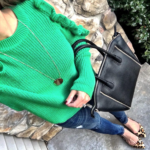 green ruffled sweater